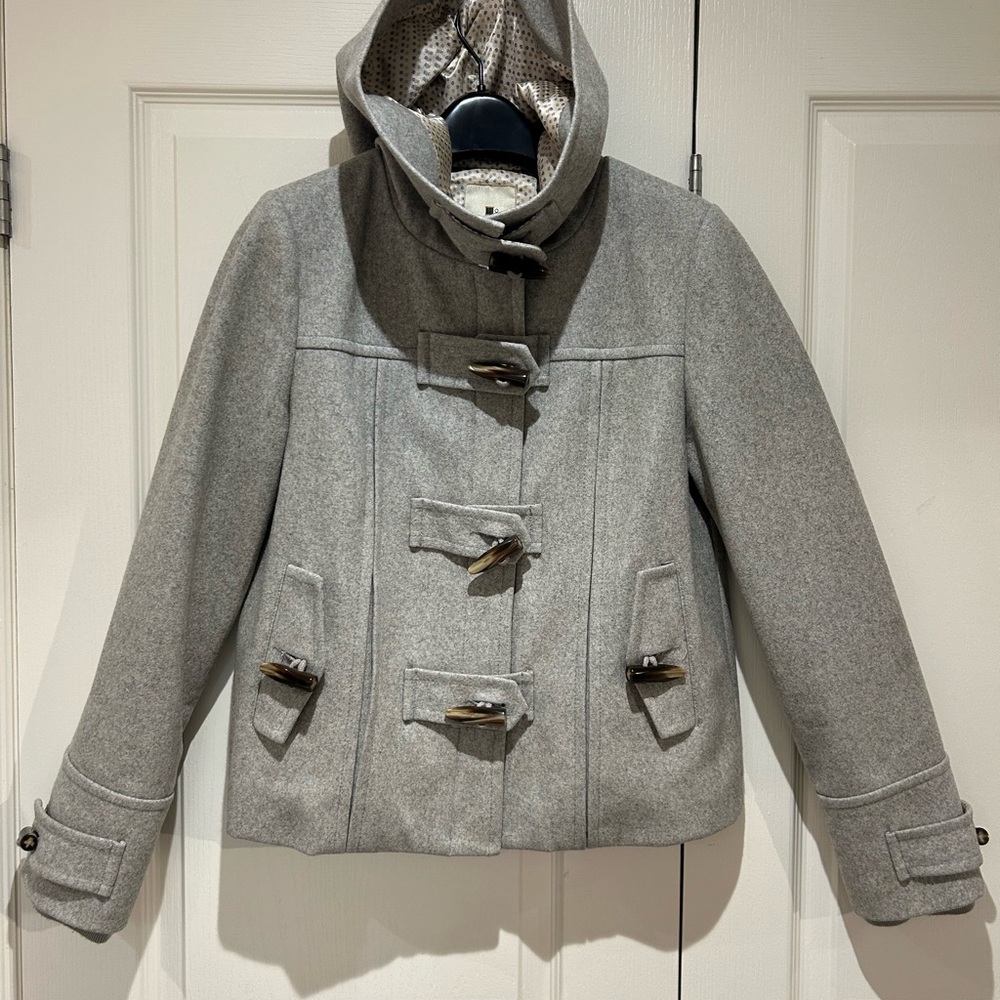 Grey Wool Coat with buttons/hood.  Very good/clean condition.